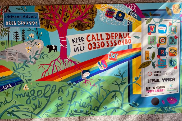 A close-up of the mural and helplines for young people