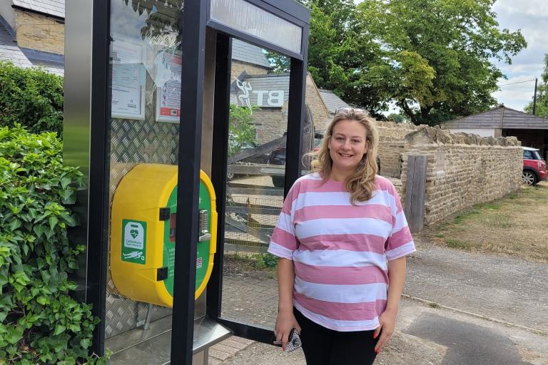 Councillor Townsend next to Haversham defibrillator