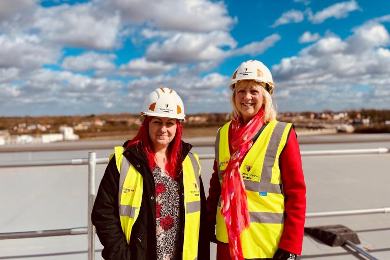 Cllr Zoe Nolan and new headteacher Vikki Pegg on the roof of Watling Primary School