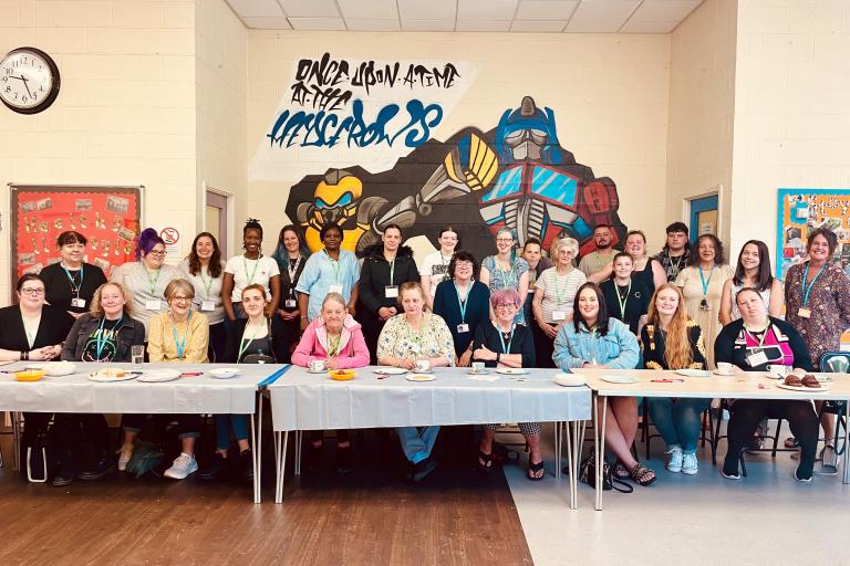 Volunteers with children and family centre staff