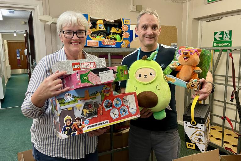 City Council colleagues sorting through boxes of toys and games