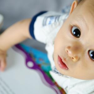 A baby reading a book