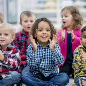 Young children enjoying songs and stories