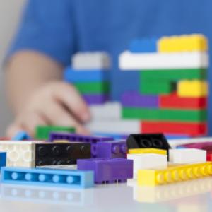 Child playing with Lego bricks